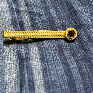 Elegant Gold Tie Clip with Red Accent